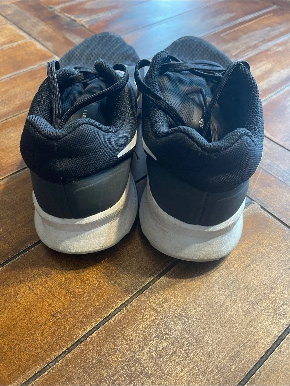 Nike Black Athletic Running Shoes with White Swoosh